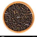 black-pepper-in-wooden-bowl-dried-berries-of-piper-nigrum-are-called-JBDY58